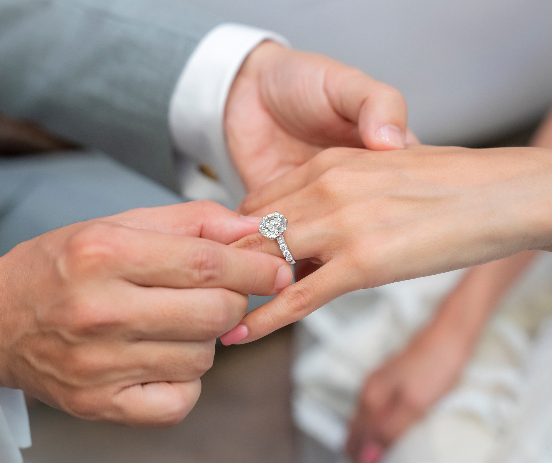 Placing diamond ring on finger